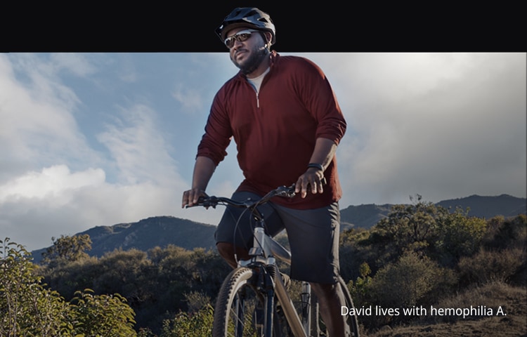 David, an adult man living with hemophilia A, rides his bicycle.