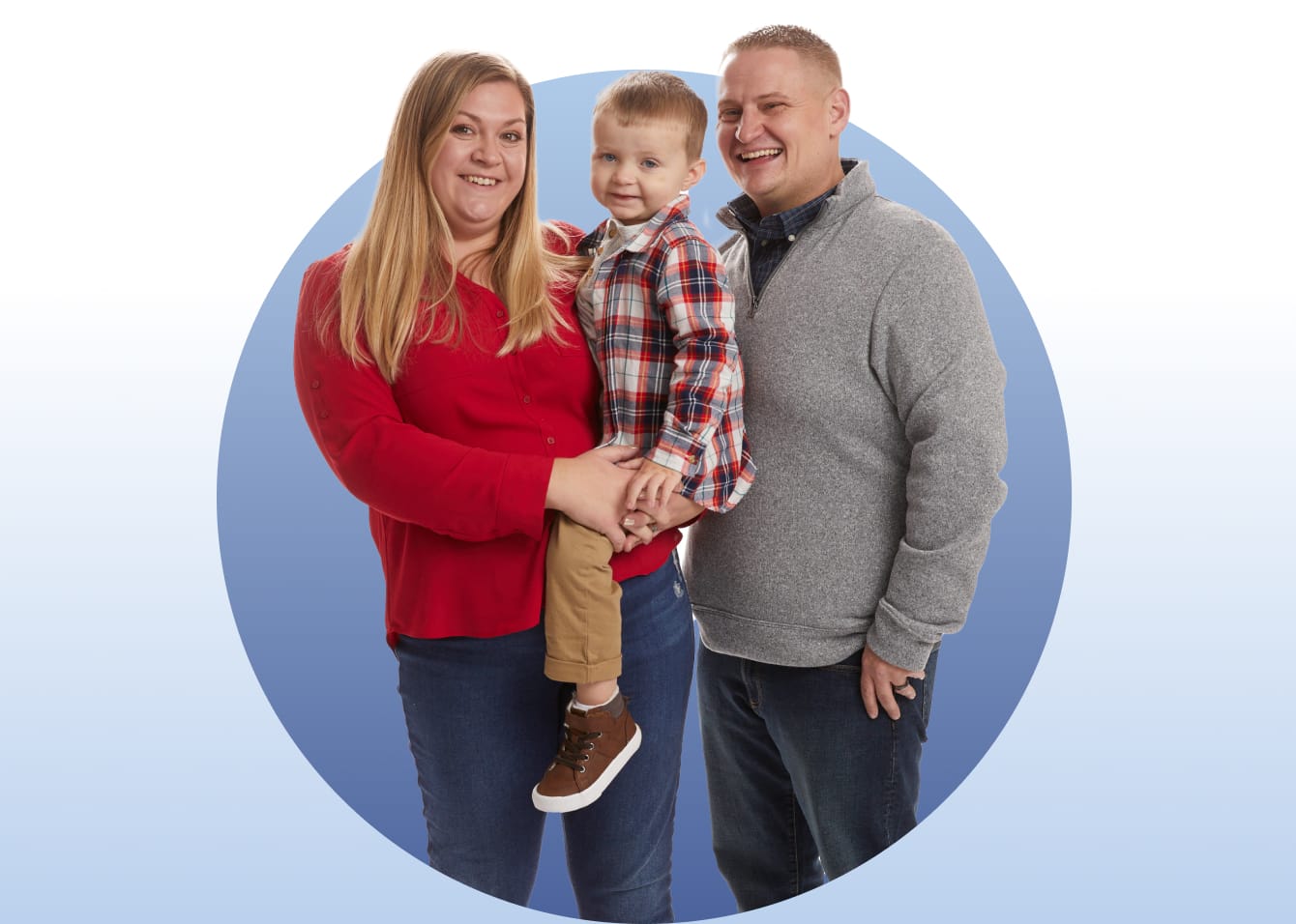 Mother and father holding their child